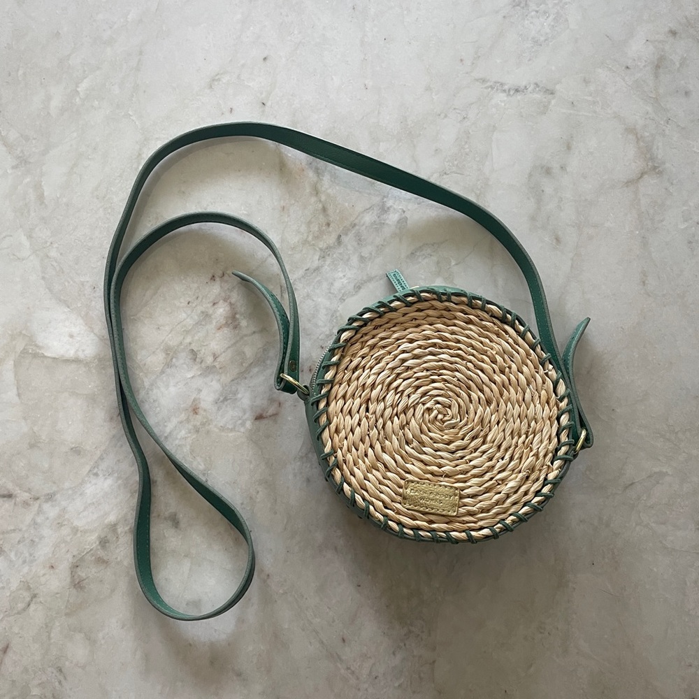 Green and Tan round rattan woven bag with over the shoulder strap